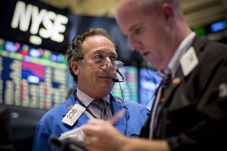 Traders work on the floor of the New York Stock Exchange October 1, 2014. REUTERS/Brendan McDermid