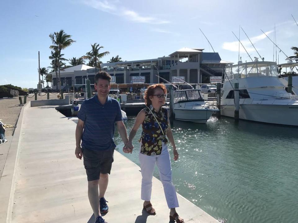 Bill and Darlene Jacobi, of northern Virginia, walk along the docks of Whale Harbor Marina in Islamorada Thursday, March 12, 2020.