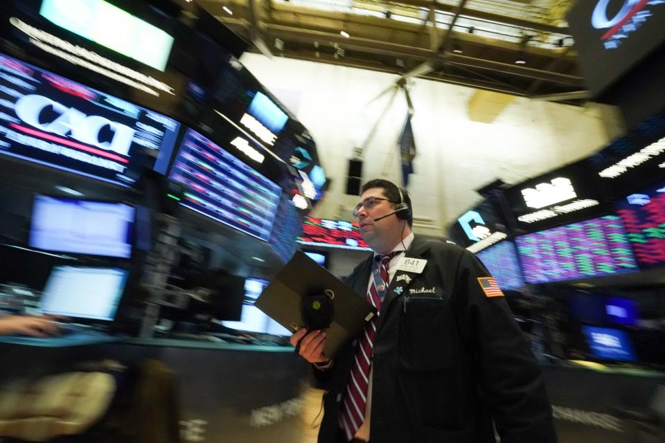 Traders work on the floor at the closing bell of the Dow Industrial Average at the New York Stock Exchange on March 11, 2020 in New York. - Wall Street stocks dove deeper into the red in afternoon trading on March 11, 2020, with losses accelerating after the World Health Organization declared the coronavirus a global pandemic. Near 1710 GMT, the Dow Jones Industrial was down more than 1,200 points, or 5.0 percent, at 23,777.17. The broad-based S&P 500 slumped 4.6 percent to 2,749.88, while the tech-rich Nasdaq Composite Index tumbled 4.4 percent to 7,979.15. (Photo by Bryan R. Smith / AFP) (Photo by BRYAN R. SMITH/AFP via Getty Images)