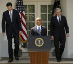 <p>President Barack Obama, followed by outgoing FBI Director Robert Mueller, right, and his choice to succeed Mueller, James Comey, left, walks towards the podium in the Rose Garden of the White House in Washington on June 21, 2013. The Justice Department on May 17, 2017, appointed Mueller as a special counsel to oversee a federal investigation into potential coordination between Russia and the Trump campaign during the 2016 presidential election. (Photo: Pablo Martinez Monsivais/AP) </p>