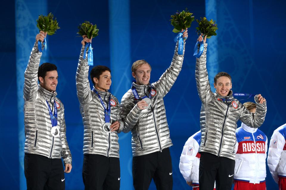 From left, Eduardo Alvarez, J.R. Celski, Chris Creveling and Jordan Malone celebrate winning the silver medal in short track speed skating men's relay during the Sochi 2014 Olympic Winter Games at the Medals Plaza on Feb. 22, 2014.