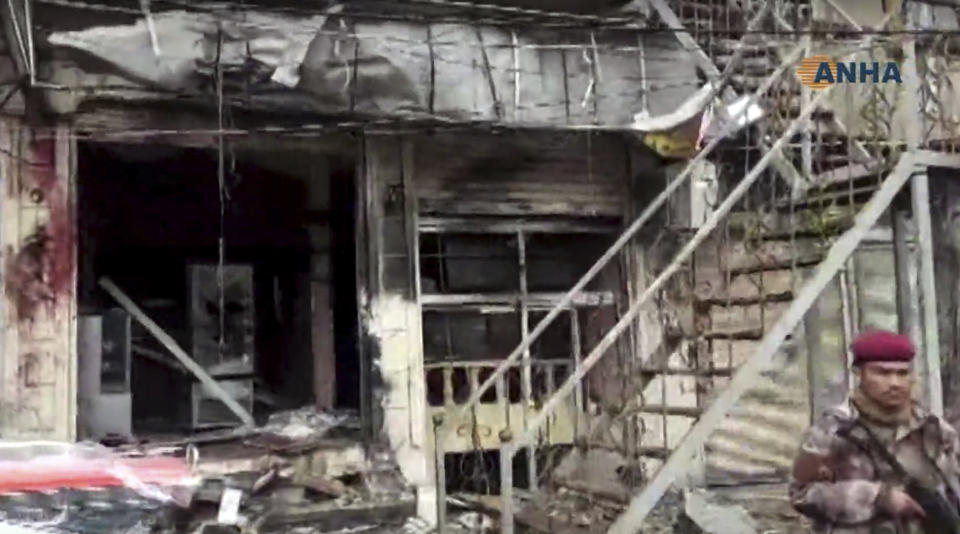 This frame grab from video provided by Hawar news, the news agency for the semi-autonomous Kurdish areas in Syria (ANHA), shows the damaged restaurant where explosion occurred near a patrol of the U.S.-led coalition, in Manbij town, Syria, Wednesday, Jan. 16, 2019. A Syrian war monitoring group and a local town council say an explosion has taken place near a patrol of the U.S.-led coalition and that there are casualties. (ANHA via AP)