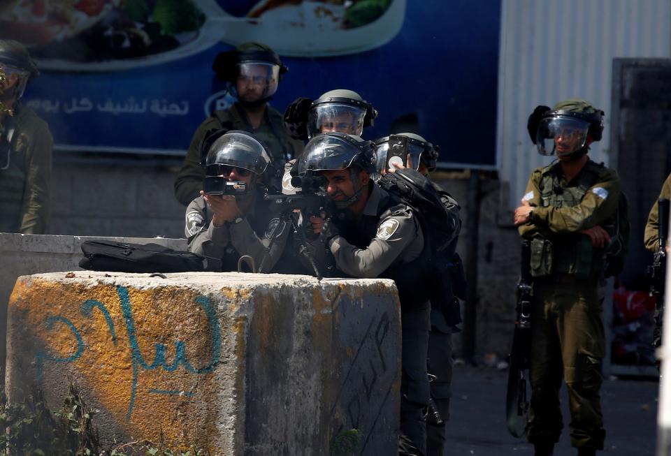 <p>Israeli security forces intervene to Palestinian demonstrators during a protest, organized to mark 70th anniversary of Nakba, also known as Day of the Catastrophe in 1948, and against United States’ plans to relocate the U.S. Embassy from Tel Aviv to Jerusalem in Bethlehem, West Bank on May 15, 2018. (Photo: Wisam Hashlamoun/Anadolu Agency/Getty Images) </p>