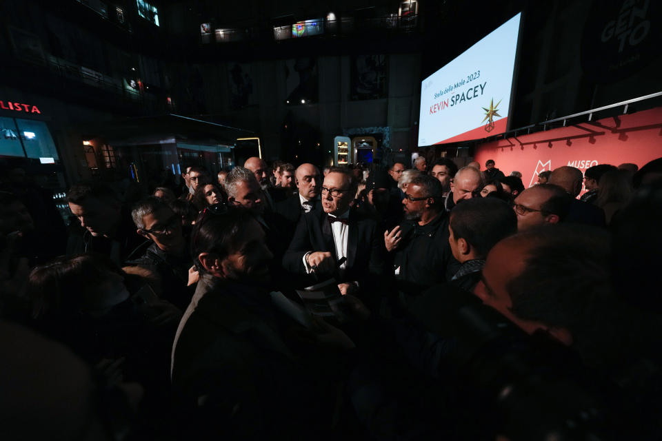 Actor Kevin Spacey is surrounded by public at the National Museum of Cinema in Turin, Monday, Jan. 16, 2023. Kevin Spacey was in the northern Italian city of Turin on Monday to receive the lifetime achievement award, teach a master class and introduce a screening of the 1999 film "American Beauty." (AP Photo/Luca Bruno)