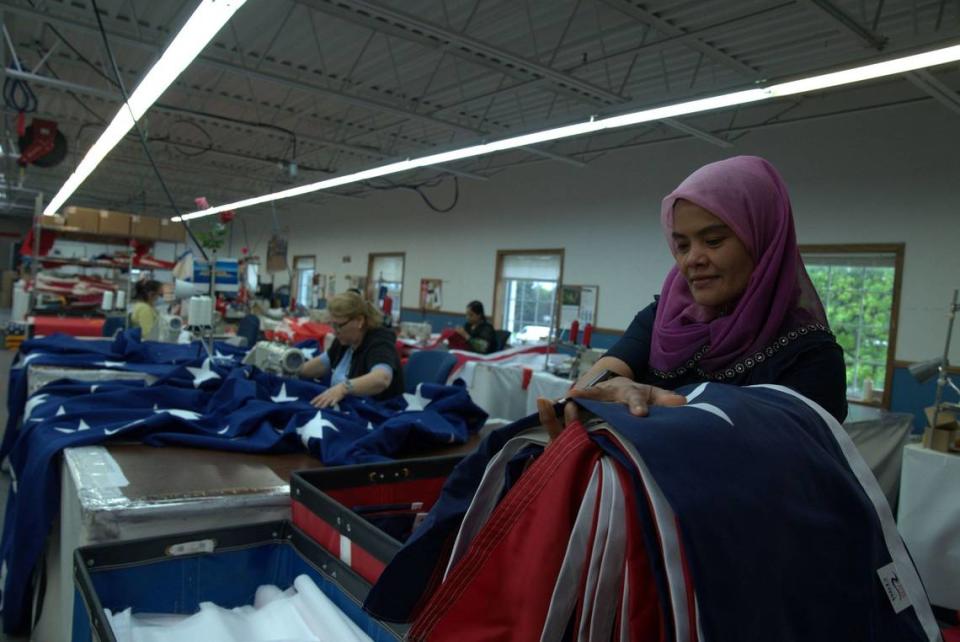 “The Flagmakers” spotlights the vast variety of workers sewing and folding flags at a Wisconsin company, including Evelia, Vasilika, Raheela and Hazarah.