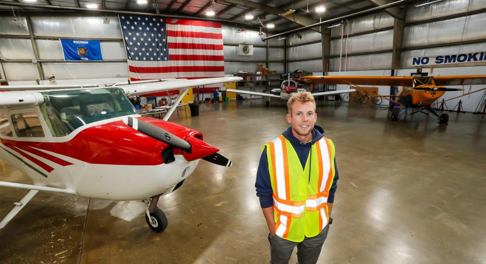 Manitowoc County Airport Manager Bryan Linger poses in hanger at the airport, Tuesday, October 11, 2022, in Manitowoc, Wis. The hanger has a spot where maintenance is performed on planes.
