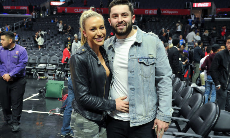 Baker Mayfield and his wife, Emily, on the court.