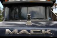 FILE PHOTO: The logo of Mack Trucks is seen on a truck in a yard in Mejicanos