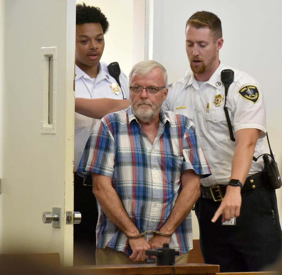 Court officers direct Richard Collins, 71, of Ipswich into the courtroom at Barnstable District Court on Wednesday morning for an arraignment on charges in connecting with a crash on Tuesday in Marstons Mills that killed 18-year-old motorcyclist Sam Needham.