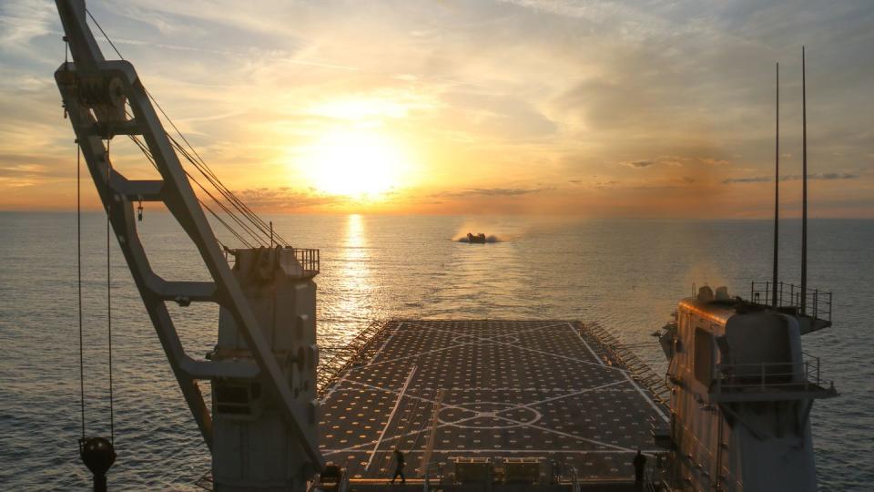 A landing craft air cushion approaches the well deck of the dock landing ship USS Carter Hall on Feb. 7, 2023, during efforts to recover a high-altitude surveillance balloon shot down Feb. 4 over the Atlantic Ocean. (Lt. j.g. Jerry Ireland/Navy)