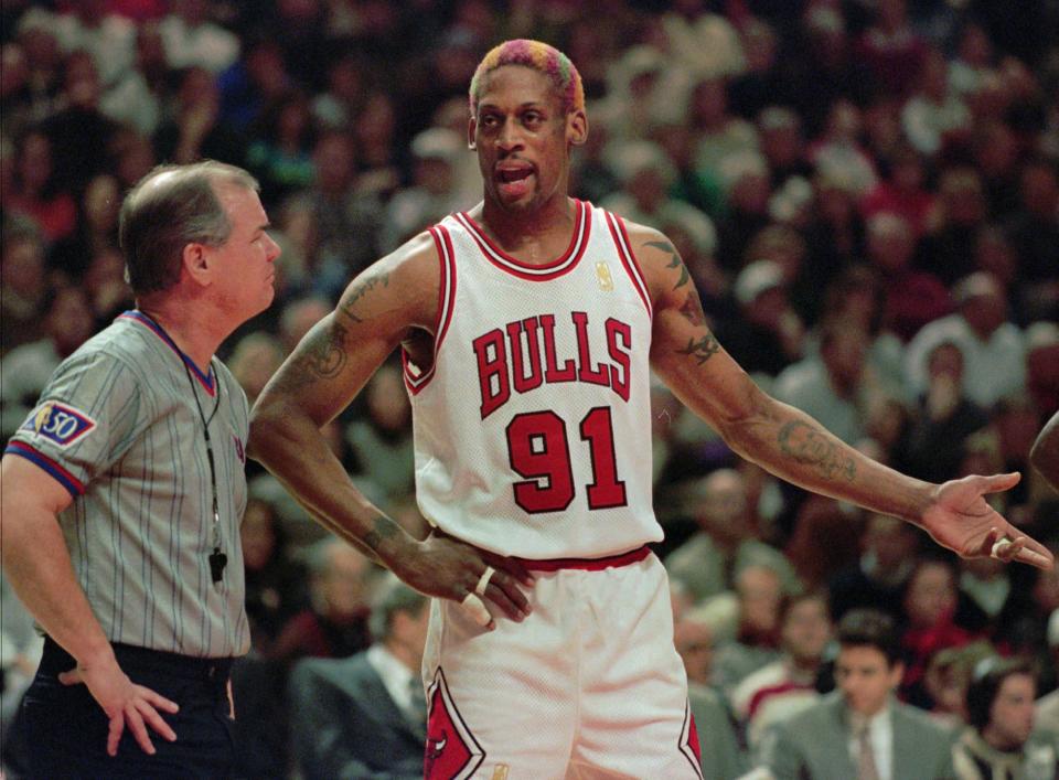 Chicago Bulls forward Dennis Rodman pleads his case to official Joe Crawford after Rodman was charged with a technical foul in the first quarter against the Houston Rockets in Chicago, Saturday, Jan. 11, 1997. (AP Photo/Michael Conroy)