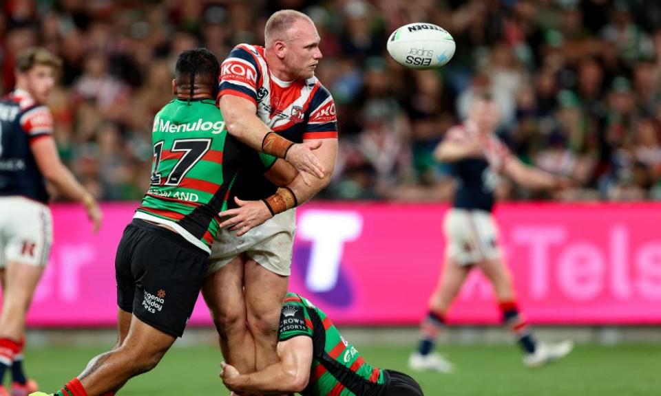 Matthew Lodge of the Roosters offloads the ball in the recent meeting with the Rabbitohs.