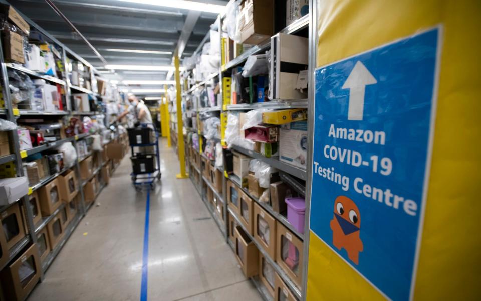 View of an aisle in an Amazon warehouse in Kegworth, near Derby - David Rose