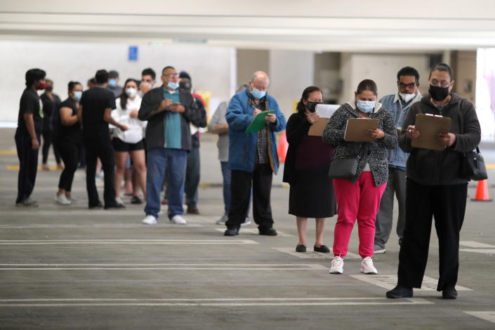 People wait for coronavirus disease (COVID-19) vaccinations, in Los Angeles, California on April 12, 2021. (Lucy Nicholson/Reuters)