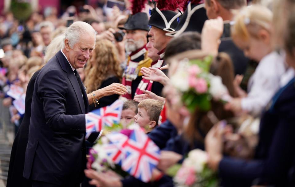 13 September 2022: Crowds cheer as King Charles III and Camilla, Queen Consort arrive for a visit to Hillsborough Castle (Getty)