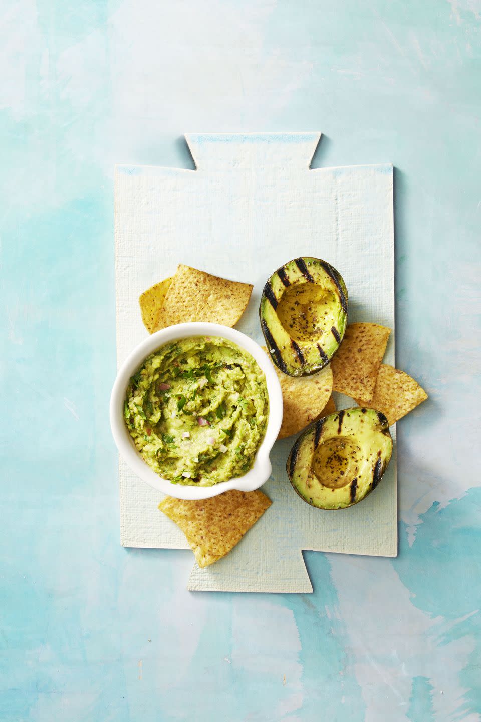 <p>Sure, you may not be able to dunk tortilla chips into guac, but you can still enjoy some with vegetables (or just a spoon). Pro tip: Stuff the avocado skins with guac for presentation points, and serve individually to your guests.</p><p><em><a href="https://www.goodhousekeeping.com/food-recipes/a38753/smoky-guacamole-recipe/" rel="nofollow noopener" target="_blank" data-ylk="slk:Get the recipe for Smoky Guacamole »;elm:context_link;itc:0;sec:content-canvas" class="link "><em>Get the recipe for Smoky Guacamole <em><em>»</em></em></em></a></em> </p>