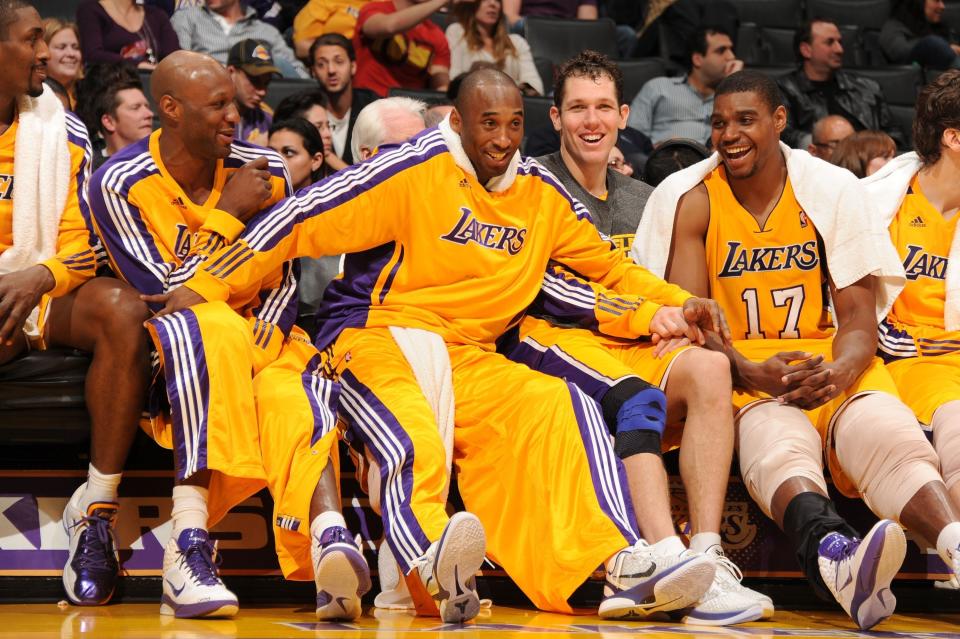 Bryant, Andrew Bynum, Lamar Odom, Metta World Peace and Luke Walton laugh on&nbsp;the bench during a game against the Utah Jazz on Jan. 25, 2011.