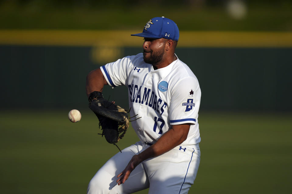 Indiana State infielder Miguel Rivera (17) commits an error allowing TCU Brayden Taylor to reach first base during the first inning of an NCAA college baseball super regional game in Fort Worth, Texas, Saturday, June 10, 2023. (AP Photo/LM Otero)