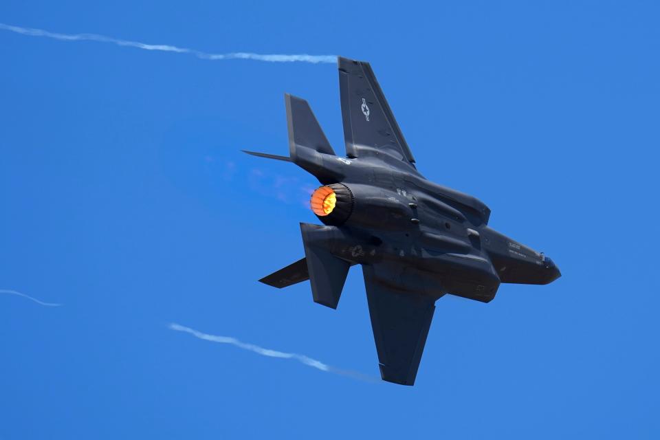 A US Air Force fighter aircraft F-35 performs aerobatic maneuvers on the second day of the Aero India 2023 at Yelahanka air base in Bengaluru, India, Tuesday on Feb. 14, 2023.