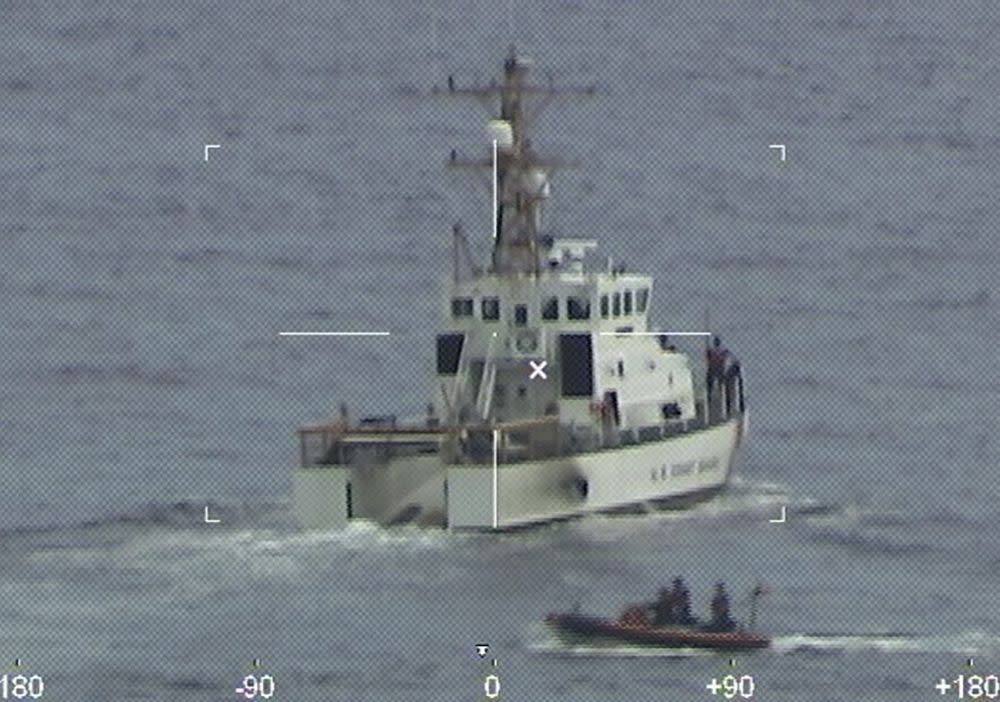 Coast Guard Cutter Ibis' crew searching for people missing from a capsized boat off the coast of Florida on Tuesday.