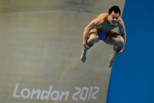 China's He Chong competes in the men's 3m springboard final during the diving event at the London 2012 Olympic Games in London. He won the bronze medal