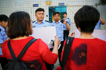 Relatives of those detained in what is known as the "709" crackdown protest in front of the Supreme People's Procuratorate in Beijing, China July 7, 2017. REUTERS/Damir Sagolj