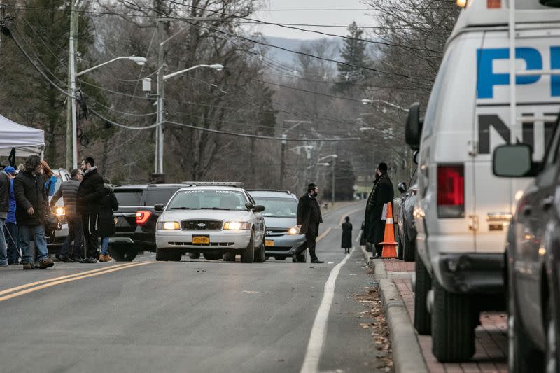 A patrol vehicle is seen near Rabbi Chaim Rottenberg's residence in Monsey