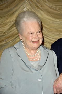 <span class="caption">Star: de Havilland at a 2006 screening of The Heiress.</span> <span class="attribution"><a class="link " href="https://www.flickr.com/photos/publicresourceorg/494054673/in/photolist-KEaf2-8UGTDu-4cnVB6-8HVnA8-qXW9Da-5DBfup-5DFwRf-5DBeu6-AiuurR-dQHUWj-uwWce-5u1ywY-5u1yB7-5tWazR-p8agmz-zCbHdw-9RptqD-bmHF2s-e7G6dF-5tYJ9b-5tYJbU-5tYJdJ-6QQUgY-bP731v-7hGku2-oVRyt-5bUWZy-NHT173-e8TFnb-8Eozj9-A2SqjG-AjsiG6-5tYJao-AigVey-8PHy9g-4Dmx45-4DmxfA-8ARvyH-nxwrSy-4vj4g-un2Tzw-4j3xYm-o6txsL-8YMfJF-8YQmfq-8YMdSe-8YMcc4-7HdZP3-Ayacm2-gHAzxk" rel="nofollow noopener" target="_blank" data-ylk="slk:Shutterstock;elm:context_link;itc:0;sec:content-canvas">Shutterstock</a></span>