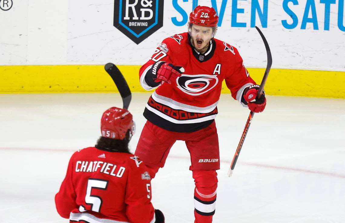 Carolina center Sebastian Aho (20) celebrates with defenseman Jalen Chatfield (5) after Chatfield scored during the first period of game two between the Hurricanes and Panthers in the Eastern Conference Finals at PNC Arena in Raleigh, N.C., Saturday, May 20, 2023. Ethan Hyman/ehyman@newsobserver.com