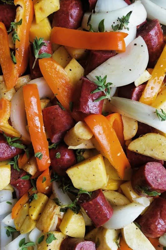 <p>Reluctant Entertainer</p><p>A lovely parsnips rutabaga sausage sheet pan dinner filled with vegetables, our favorite beef sausage, olive oil and fresh herbs.</p><p><strong>Get the recipe: <a href="https://reluctantentertainer.com/parsnips-rutabaga-sausage-sheet-pan-dinner/" rel="nofollow noopener" target="_blank" data-ylk="slk:Parsnips Rutabaga Sausage Sheet Pan Dinner;elm:context_link;itc:0;sec:content-canvas" class="link "><em>Parsnips Rutabaga Sausage Sheet Pan Dinner</em></a></strong></p>