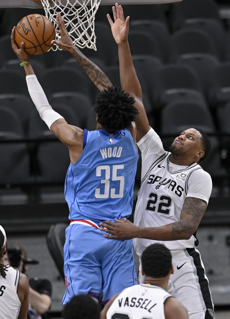 Houston Rockets' Christian Wood (35) shoots against San Antonio Spurs' Rudy Gay during the first half of an NBA basketball game, Saturday, Jan. 16, 2021, in San Antonio. (AP Photo/Darren Abate)