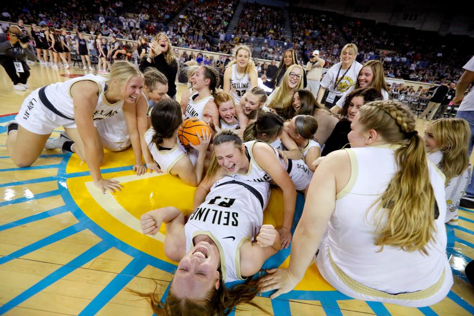 Seiling players celebrate after wining the Class A girls state basketball championship game between Seiling and Oklahoma Bible Academy at State Fair Arena in Oklahoma City, Saturday, March 2, 2024.