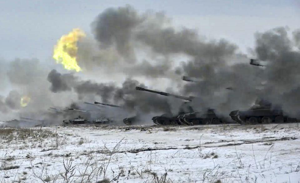 FILE - In this image taken from video and released by Russian Defense Ministry Press Service, Russian army's self-propelled howitzers fire during military drills near Orenburg in the Urals, Russia, Dec. 16, 2021. The Russian invasion of Ukraine is the largest conflict that Europe has seen since World War II, with Russia conducting a multi-pronged offensive across the country. The Russian military has pummeled wide areas in Ukraine with air strikes and has conducted massive rocket and artillery bombardment resulting in massive casualties. (Russian Defense Ministry Press Service via AP, File)