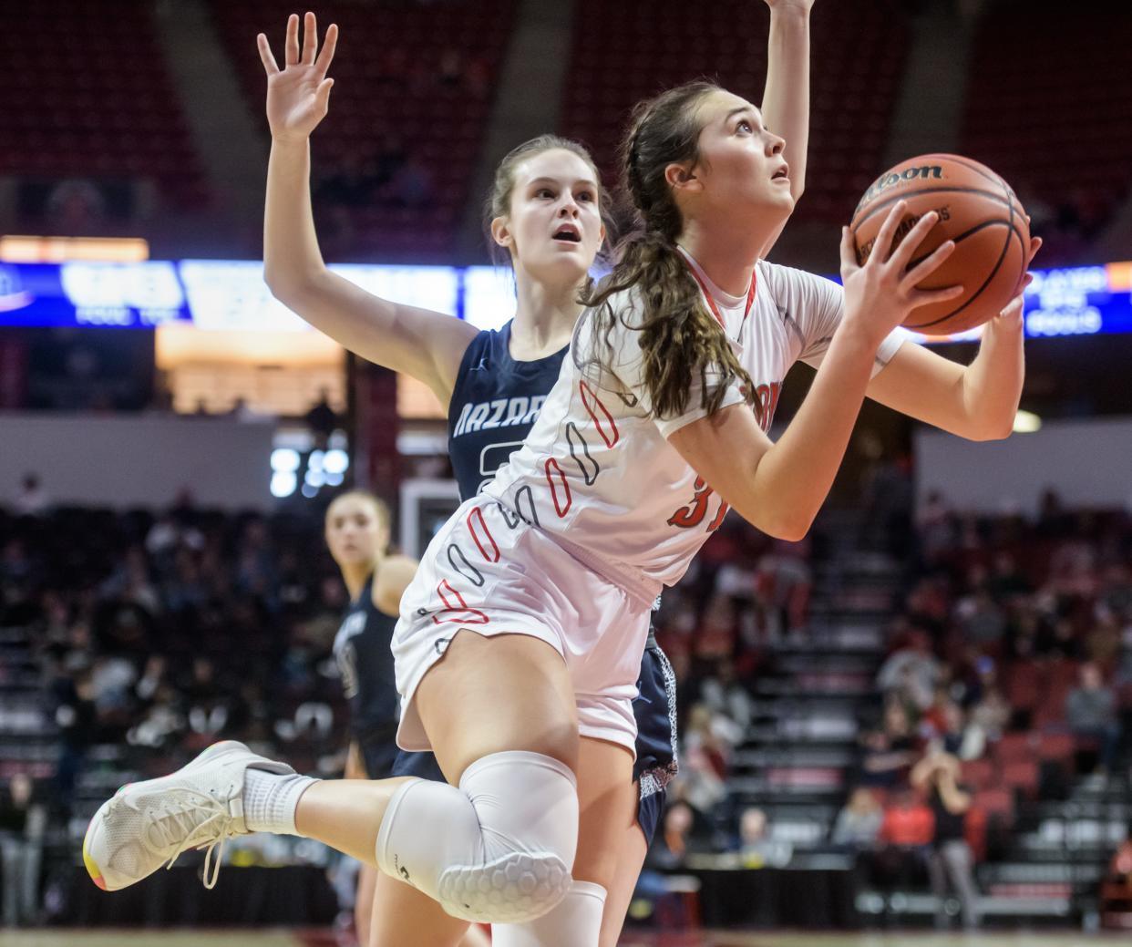 Morton's Katie Krupa, foreground, gets around Nazareth Academy's Gracie Carstensen for a shot in the first half of their Class 3A state semifinals Friday, March 4, 2022 at Redbird Arena in Normal. The Potters fell to the Roadrunners 55-24.