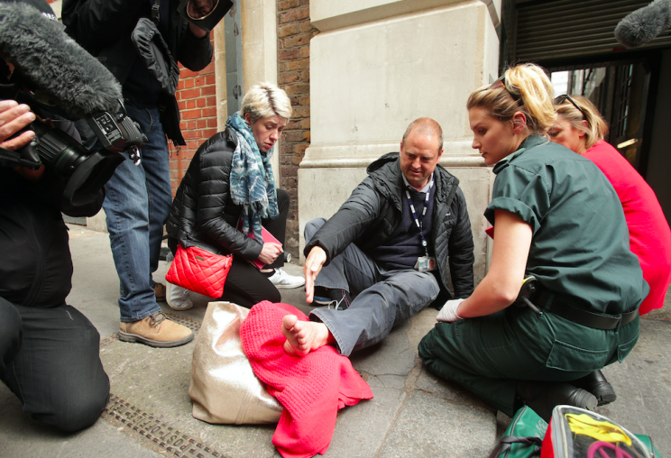 BBC cameraman Giles Wooltorton was attended to after his foot was run over by Jeremy Corbyn's car (PA)