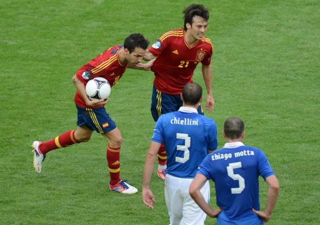 Spanish forward Cesc Fabregas (L) is congratualted by teammate Spanish midfielder David Silva after scoring during the Euro 2012 championships football match Spain vs Italy on June 10, 2012 at the Gdansk Arena. AFPPHOTO/ PATRIK STOLLARZPATRIK STOLLARZ/AFP/GettyImages