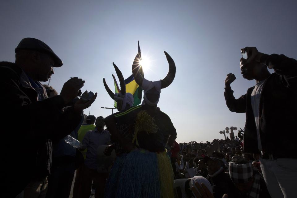 African migrants from Sudan wear traditional costumes during a protest outside the U.S. embassy in Tel Aviv