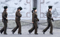 <p>Female North Korean soldiers patrol along the banks of Yalu River, near the North Korean town of Sinuiju, opposite the Chinese border city of Dandong, April 11, 2013. (Jacky Chen/Reuters) </p>