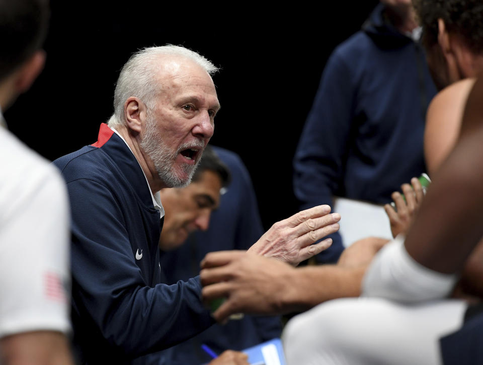 U.S head coach Gregg Popovich talks to player in a time-out during their exhibition basketball game in Melbourne, Thursday, Aug. 22, 2019. (AP Photo/Andy Brownbill)