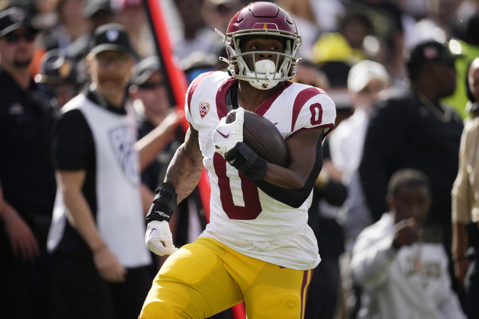 Southern California running back MarShawn Lloyd runs in for a touchdown in the first half of an NCAA college football game against Colorado, Saturday, Sept. 30, 2023, in Boulder, Colo. (AP Photo/David Zalubowski)