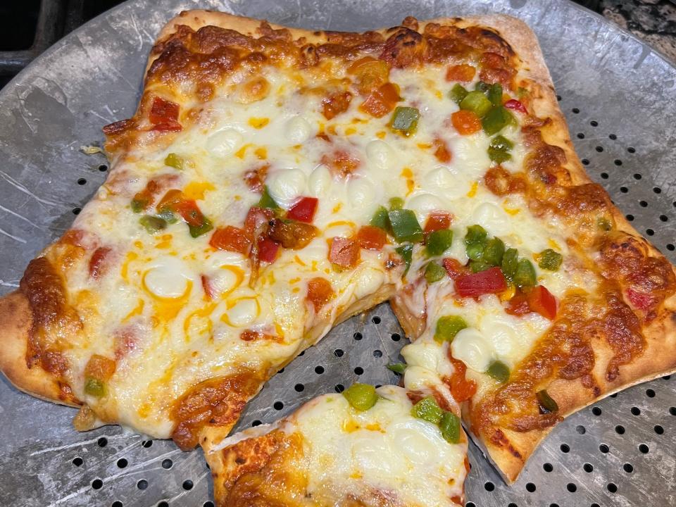 Star-shaped Mama Cozzi's pizza baked on a pizza pan