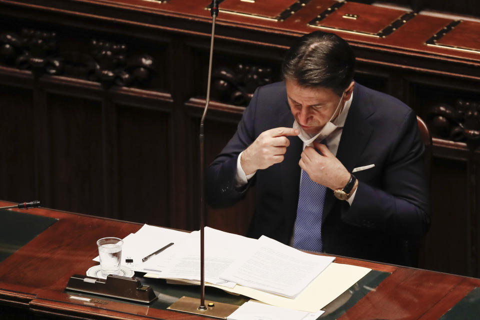 Premier Giuseppe Conte delivers his speech at the lower chamber of Parliament, in Rome, Monday, Jan. 18, 2021. Conte fights for his political life with an address aimed at shoring up support for his government, which has come under fire from former Premier Matteo Renzi's tiny but key Italia Viva (Italy Alive) party over plans to relaunch the pandemic-ravaged economy. (AP Photo/Alessandra Tarantino, pool)