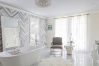 <p>A chevron marble wall is inspiring in a bathroom by <a href="https://deringhall.com/interior-designers/eclectic-home" rel="nofollow noopener" target="_blank" data-ylk="slk:Eclectic Home;elm:context_link;itc:0;sec:content-canvas" class="link ">Eclectic Home</a>.</p>