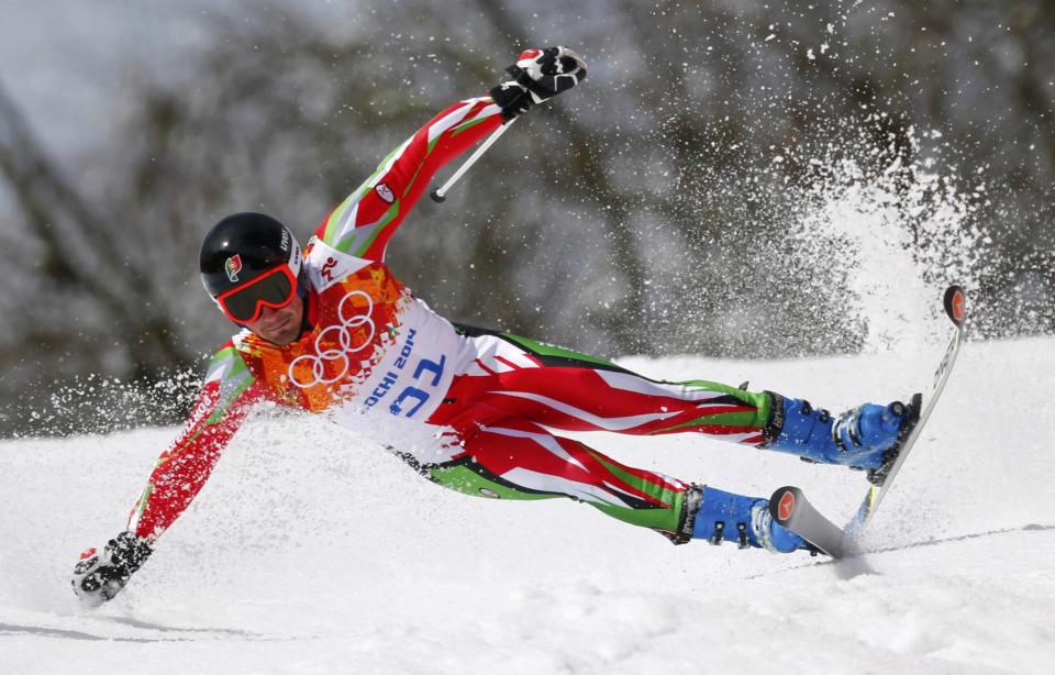 Portugal's Arthur Hanse crashes during the first run of the men's alpine skiing giant slalom event at the 2014 Sochi Winter Olympics at the Rosa Khutor Alpine Center February 19, 2014. REUTERS/Dominic Ebenbichler (RUSSIA - Tags: SPORT SKIING OLYMPICS TPX IMAGES OF THE DAY)