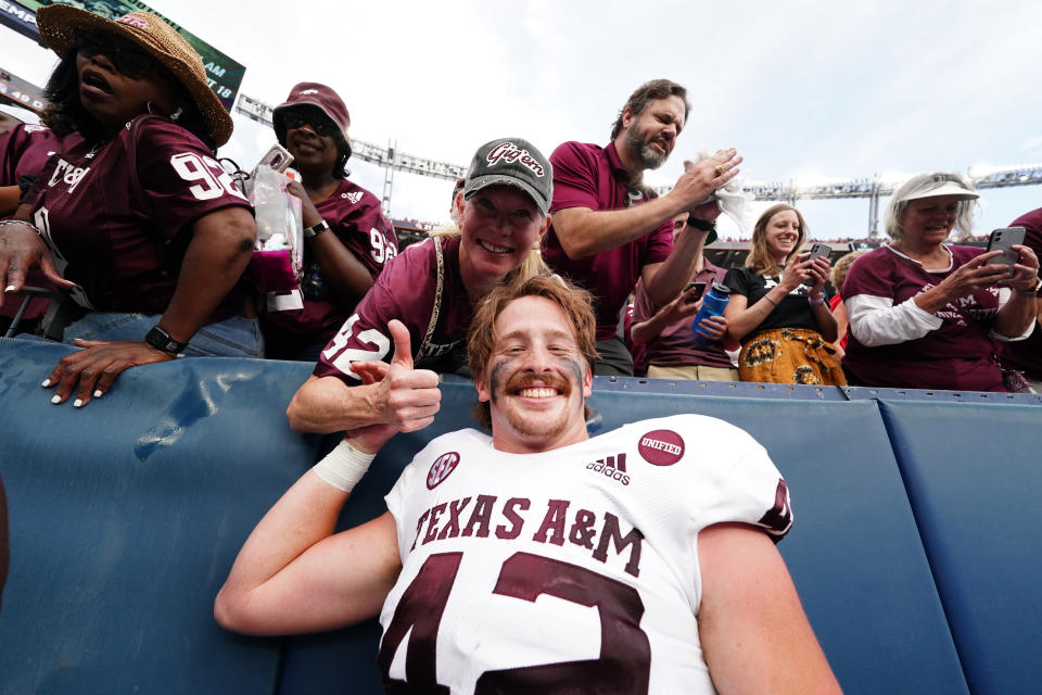 Sep 11, 2021; Denver, Colorado; Texas A&M Aggies tight end Max Wright (42) celebrates defeating the Colorado Buffaloes at Empower Field at Mile High. Ron Chenoy-USA TODAY Sports