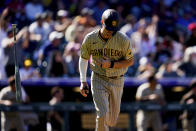 San Diego Padres' Wil Myers tosses his bat after hitting a home run in the third inning of a baseball game against the Colorado Rockies Sunday, Sept. 25, 2022, in Denver. (AP Photo/Geneva Heffernan)