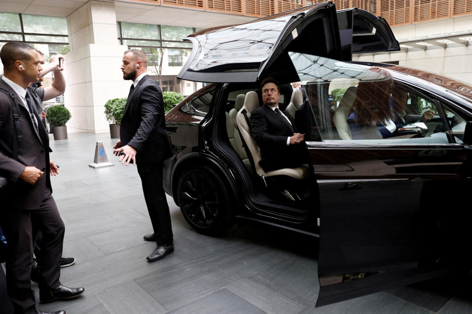 ftse FILE PHOTO: Tesla Chief Executive Officer Elon Musk gets in a Tesla car as he leaves a hotel in Beijing, China May 31, 2023. REUTERS/Tingshu Wang/File Photo