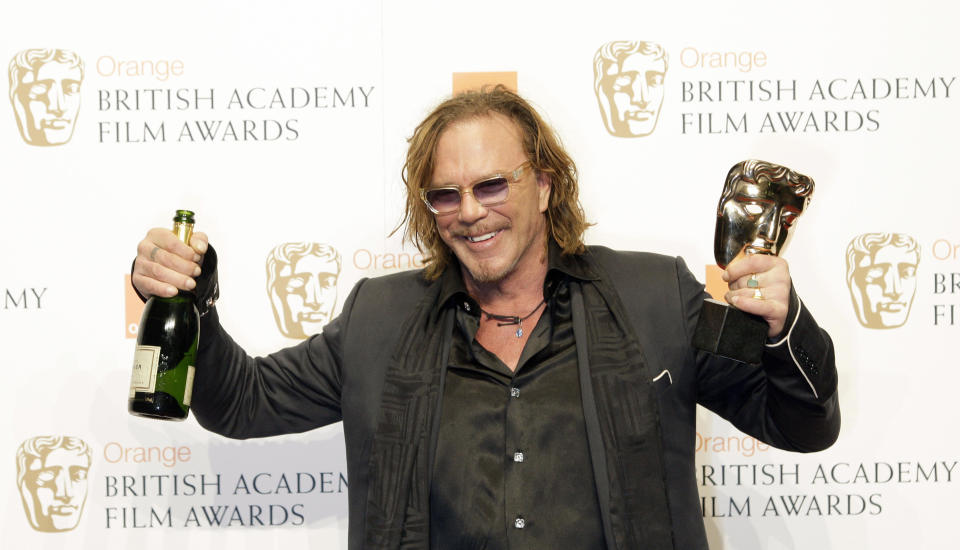Picture embargoed until 21:30 GMT  US actor Mickey Rourke poses for photographers with his British Academy of Film and Television Award (BAFTA) for &#39;Leading actor&#39; for the film &#39;The Wrestler&#39; at the Royal Opera House in central London, on February 8, 2009. AFP PHOTO/Shaun Curry (Photo credit should read SHAUN CURRY/AFP via Getty Images)