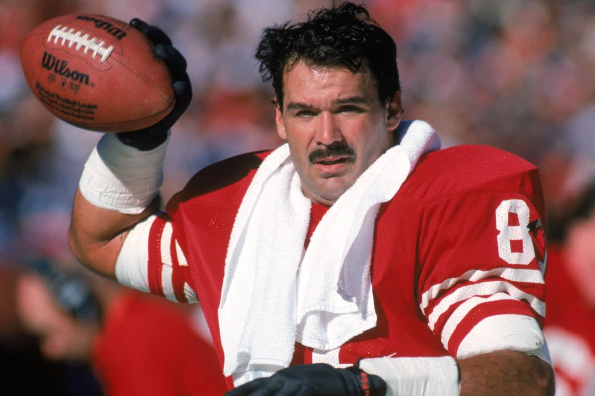 Russ Francis of the San Francisco 49ers warms-up on the sideline during a game against the New Orleans Saints in 1987 (Getty)