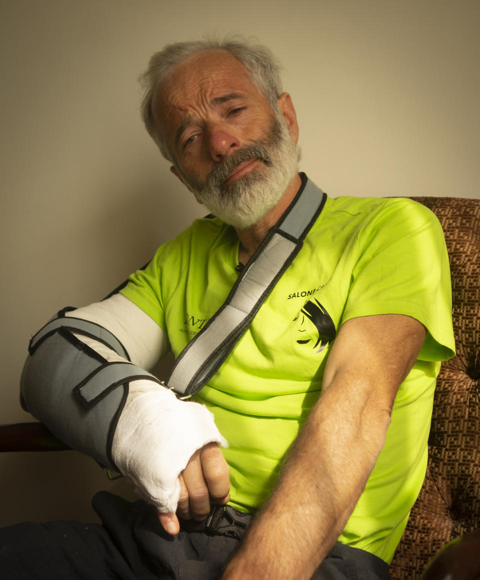 The team leader, Tarcisio Bellò, 57, talks to the Associated Press regarding losing his Pakistani colleague, in Islamabad, Pakistan, Thursday, June 20, 2019. The renowned Italian mountaineer, who narrowly survived along-with six other members of an expedition on a mountain, burst into tears Thursday when he recalled how helplessly he saw one of his Pakistani colleagues being swept away by an avalanche that struck them at an altitude of around 5,300 meters (17,390 feet) earlier this week. (AP Photo/B.K. Bangash)